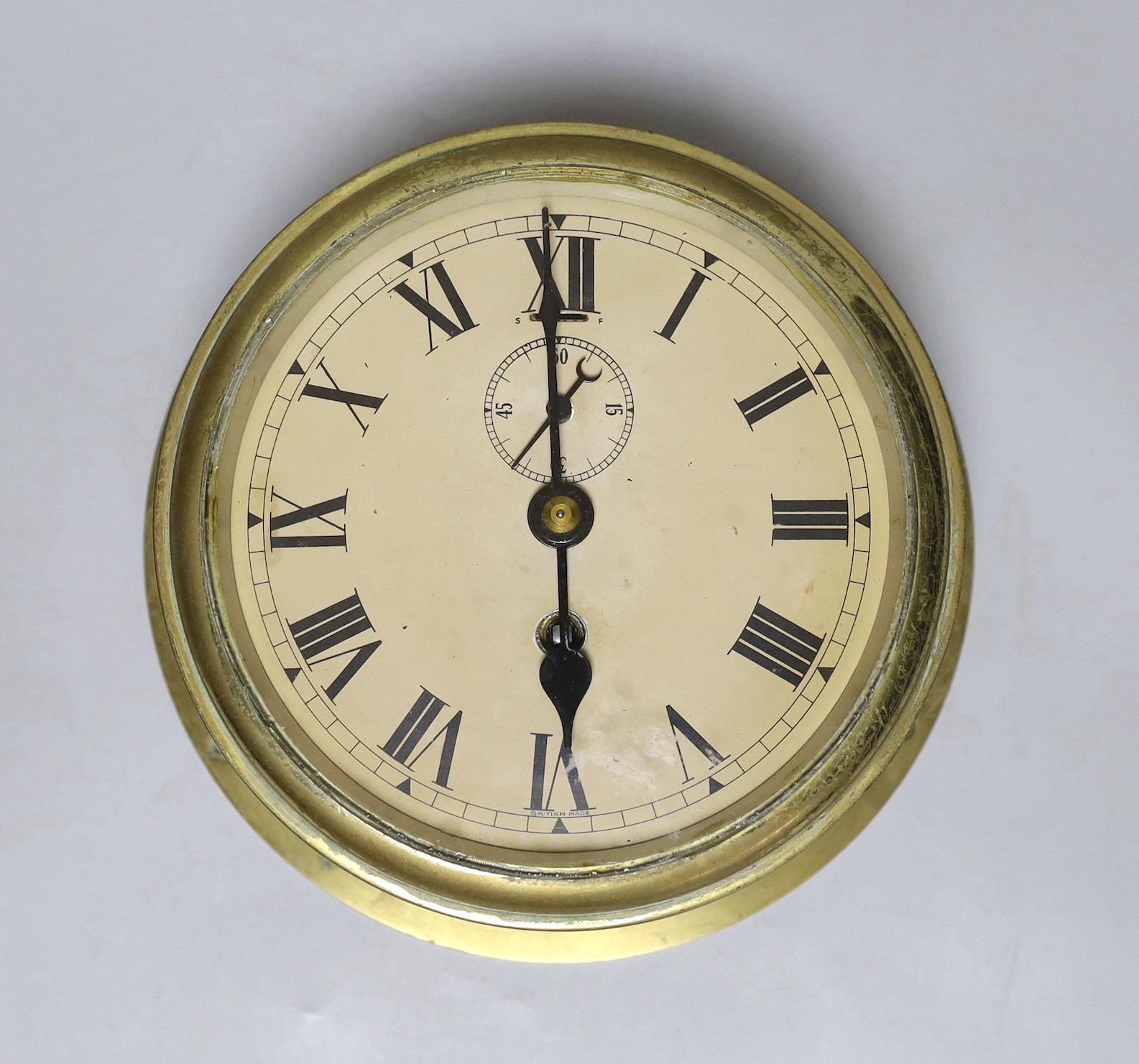 A ship's clock, made by Elliot Ltd Croydon, back plate 20.5cm diameter